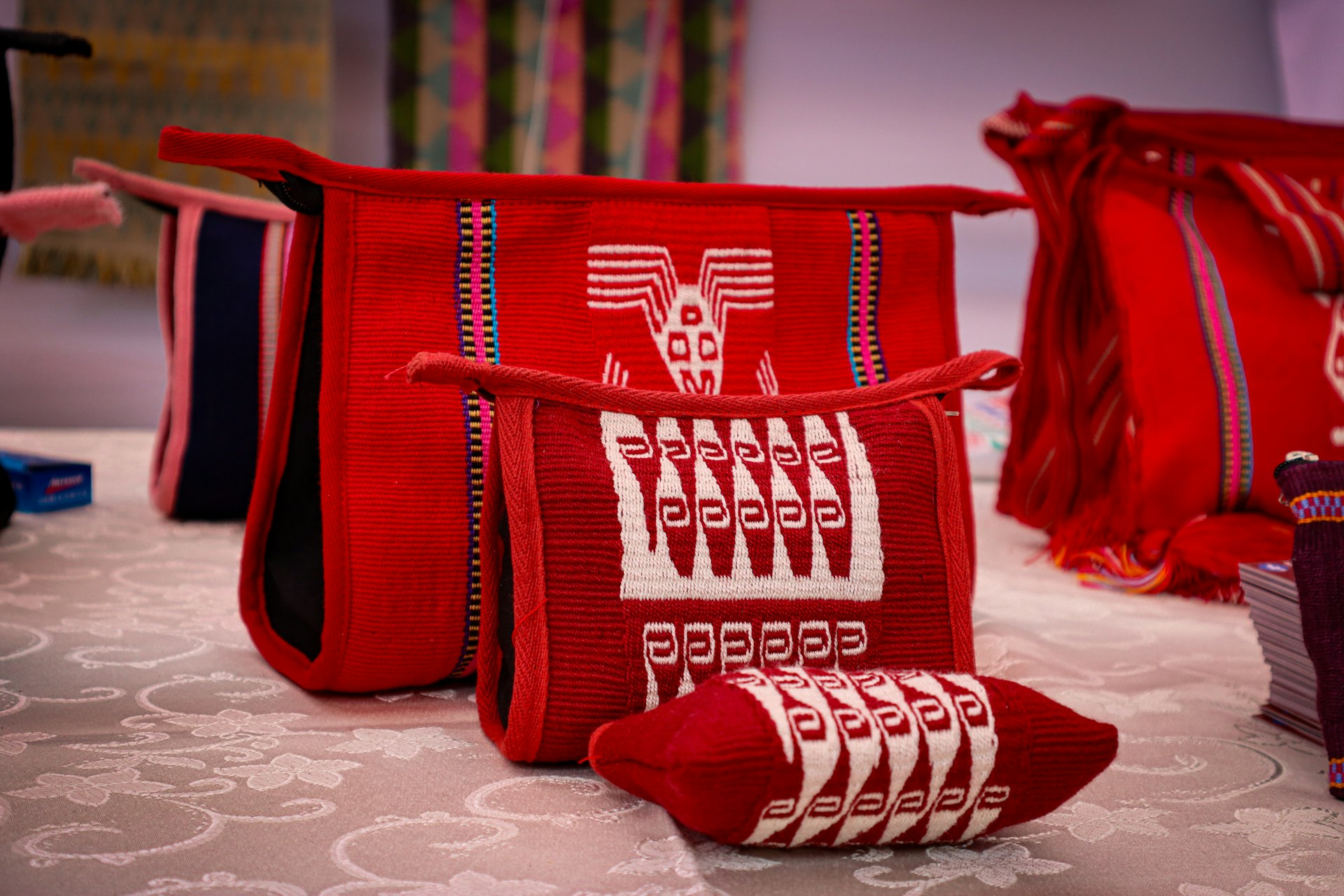 a group of red bags sitting on top of a table